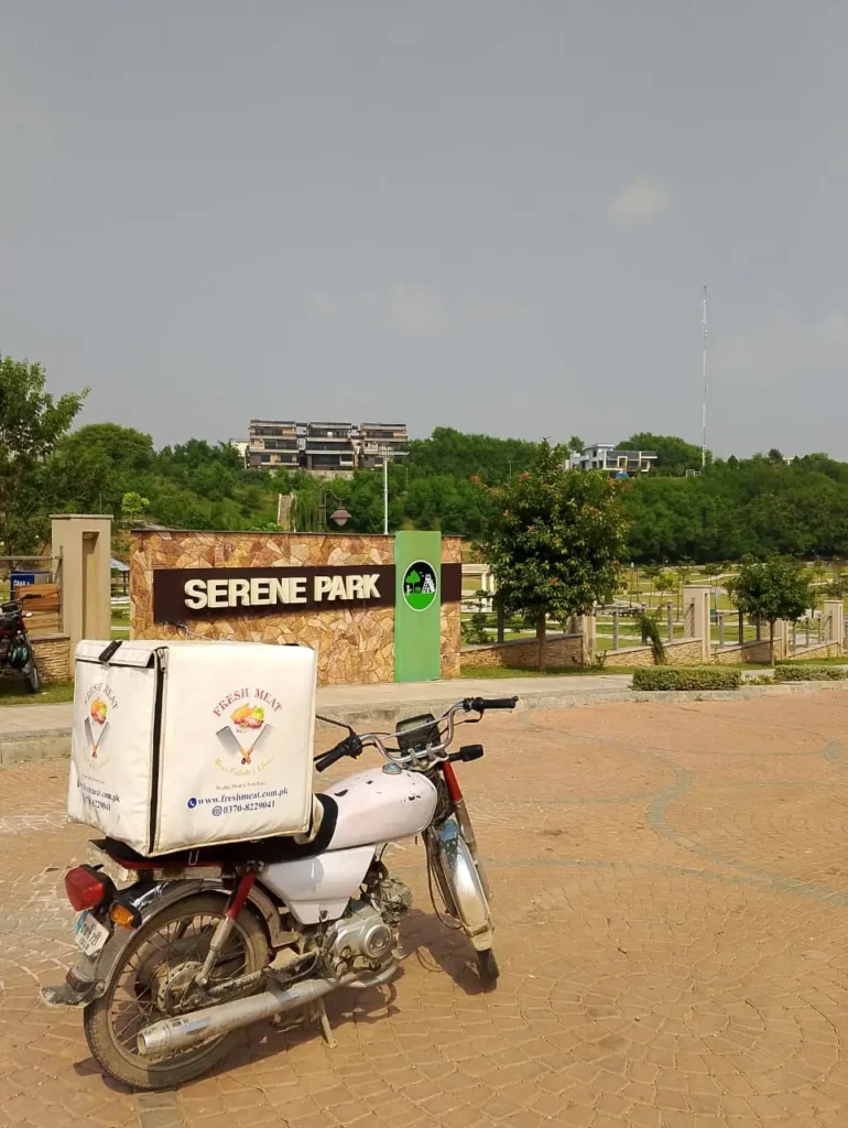 Fresh Meat Shop delivery bike at Serene Park, Serene City DHA 3