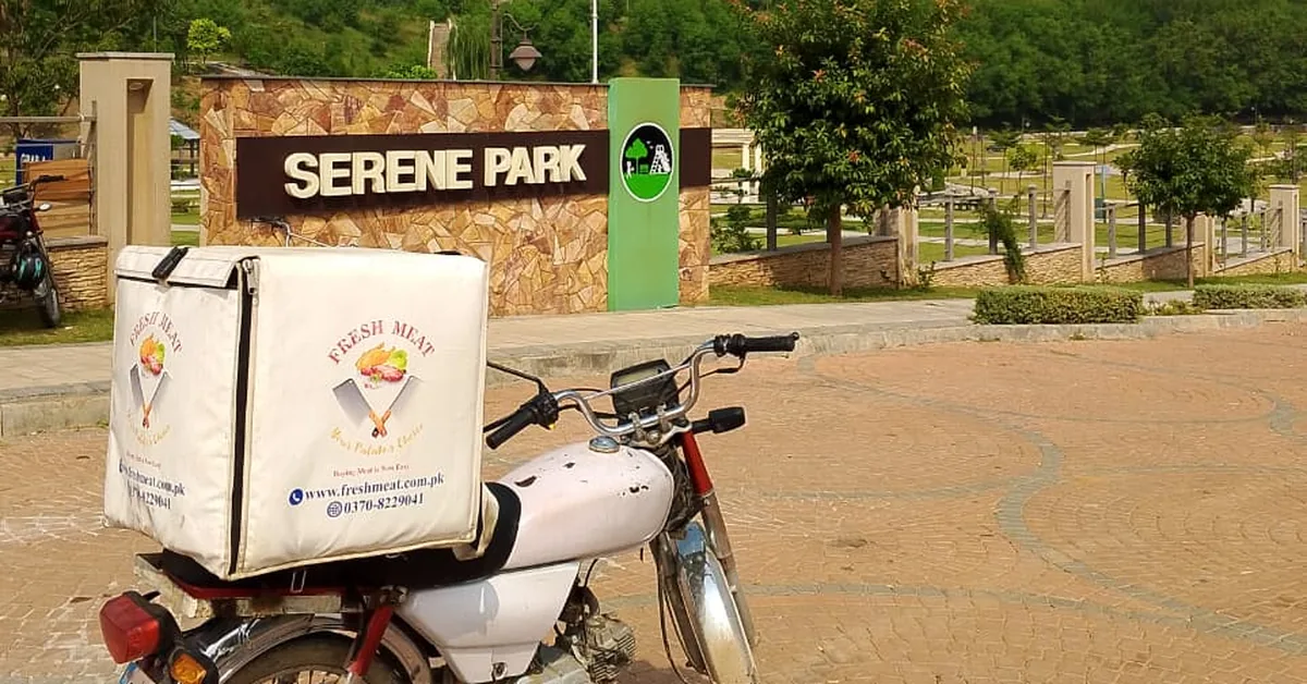 Fresh Meat Shop delivery bike at Serene Park, Serene City DHA 3